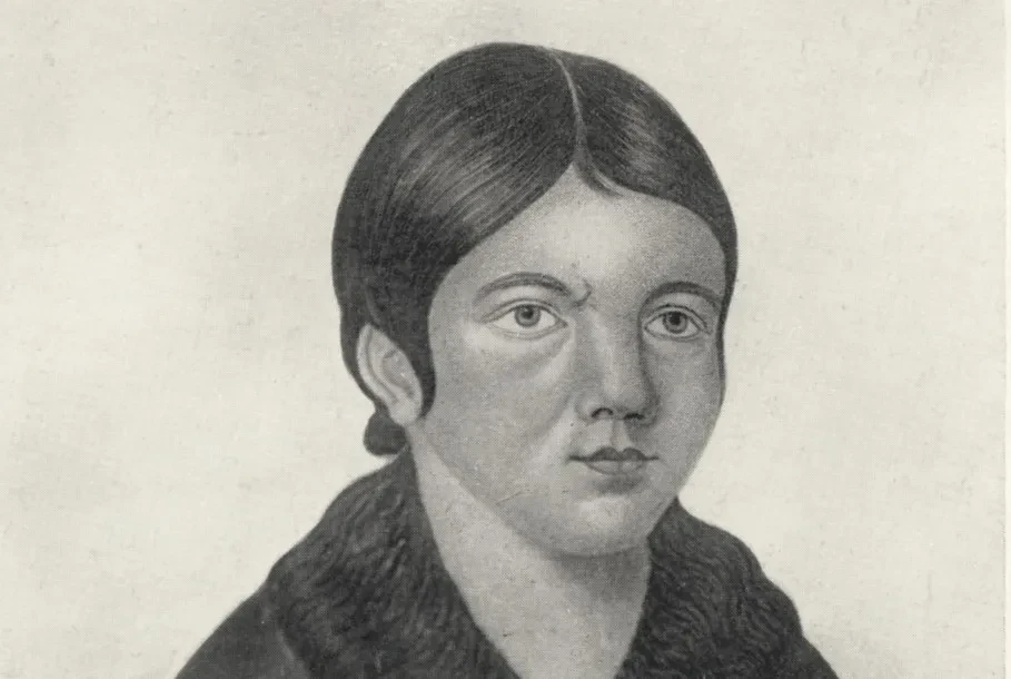 Black and white print of a woman with short, slick black hair
