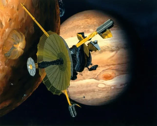 Artist's rendering of NASA's Galileo spacecraft flying past Jupiter's moon Io.
